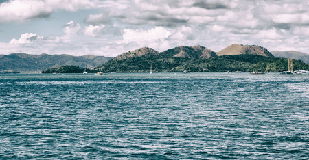 from a boat  in  philippines  snake island near el nido palawan beautiful panorama coastline sea and...