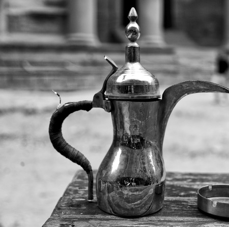 in the site of petra jordan the traditional coffe container isolated on a tableの写真素材