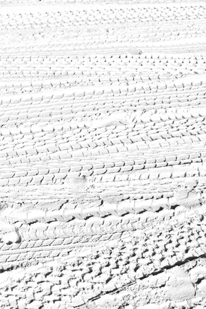 in the desert  beach track of car and truck in the sand like abstract backgroundの写真素材