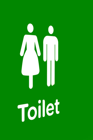 the door of the restroom and the sign for the directionの写真素材