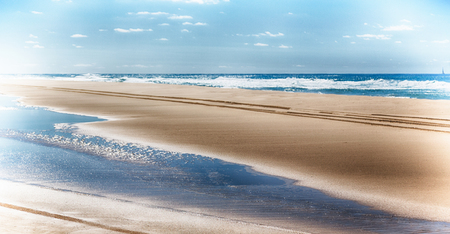 in  australia fraser island and the sand track of the cars near the ocean and skyの写真素材