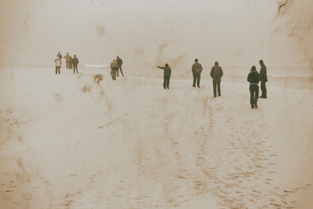 in south africa the fog and the people in the winter beachの写真素材