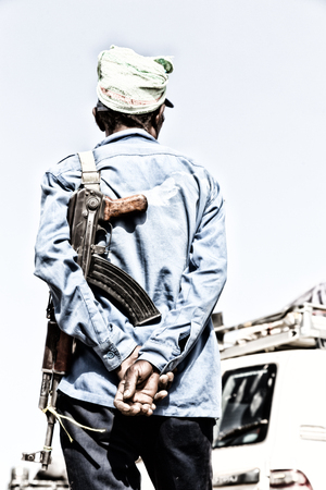 in  danakil ethiopia africa   the rifle and the back of the guard concept  of safety and protectionの写真素材