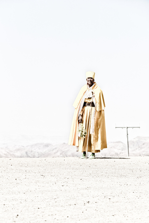  ETHIOPIA,LALIBELA-CIRCA  DECEMBER 2017--unidentified priest walking in the street  