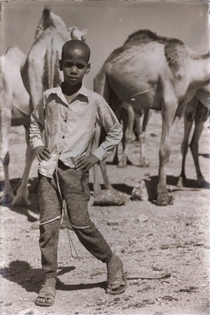 ETHIOPIA,BABILE-CIRCA  JANUARY 2018--unidentified   worker young boy in the camels market 
のeditorial素材