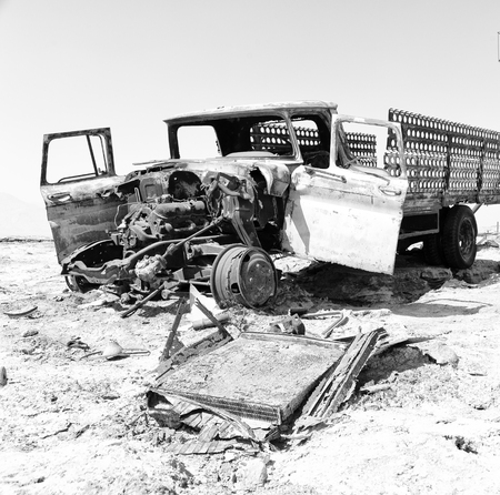 in  danakil ethiopia africa  in the   old abandoned  italian village   colony rusty antique car and...