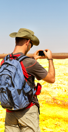 in dalol ethiopia a  backpacker near the depression volcano landの写真素材