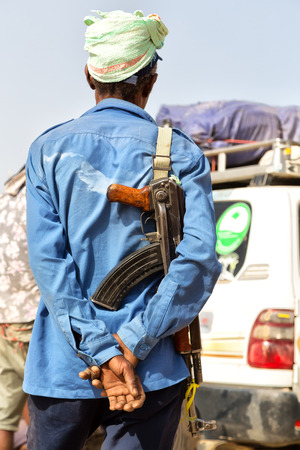 in  danakil ethiopia africa   the rifle and the back of the guard concept  of safety and protectionの写真素材