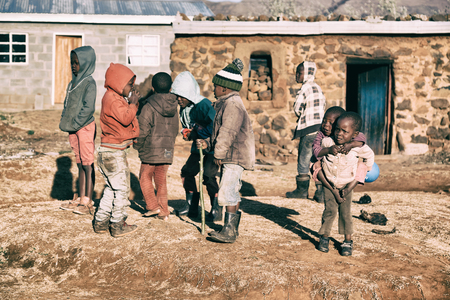 in africa group of alone children near their poor homeのeditorial素材
