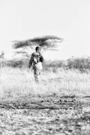 blurred  africa  in the land of ethiopia a black soldier  and his gun looking the boarderのeditorial素材