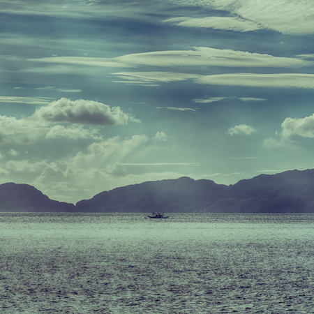 in philippines island the pacific ocean clouds and lights view from a boatの写真素材
