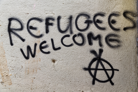 in cyprus the spray paint in the wall with refugees welcome like concept of hospitality の写真素材