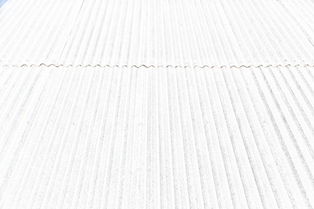 blurred abstract background texture of a corrugated metal roofの写真素材