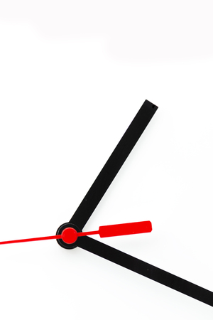 blur in the white background the clock and red arrow like concept of waste time and workの写真素材