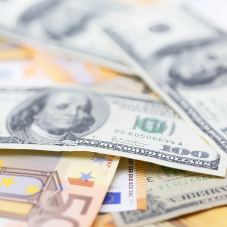 blurred dollar and euro  money background like concept of differences success prosperity and...