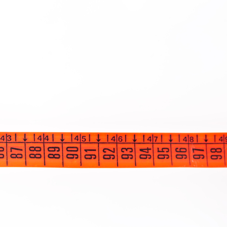 blur red  tape measure in the white light like concept of diet and lenght tool   and copy spaceの写真素材