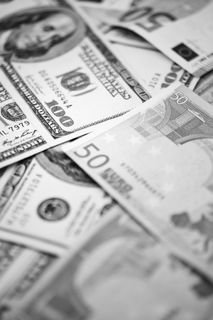 blurred dollar and euro  money background like concept of differences success prosperity and...