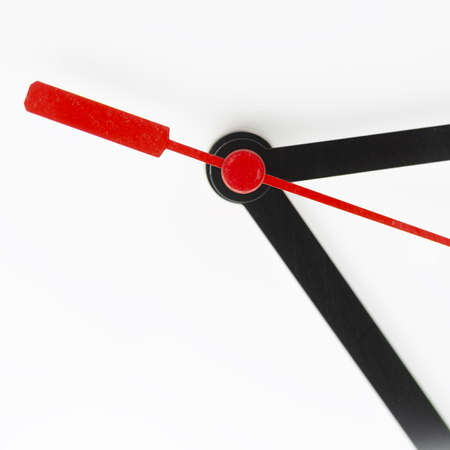 blur in the white background the clock and red arrow like concept of  waste time and workの写真素材