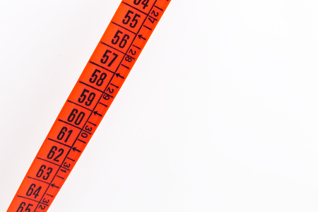 blur red  tape measure in the white light like concept of diet and lenght tool   and copy spaceの写真素材