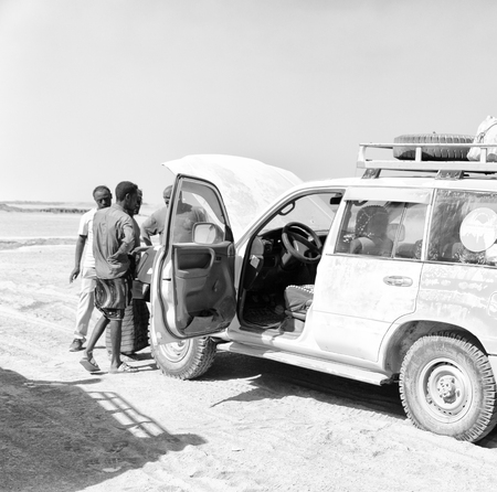 ETHIOPIA,DANAKIL-CIRCA  JANUARY 2018--unidentified  people and broken car in the land of afar peopleのeditorial素材