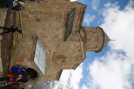 GEORGIA, GERGETI-CIRCA MAY 2019--unidentified people near the antique chatedral