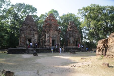 CAMBODIA, ANGKOR WAT-CIRCA DECEMBER 2019--unidentified people near the templeのeditorial素材