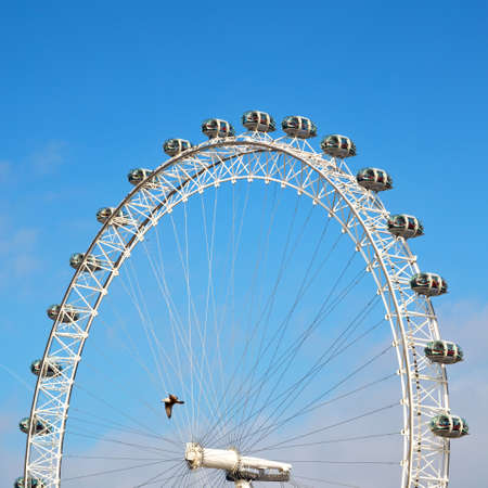 london eye in the spring sky and white cloudsのeditorial素材