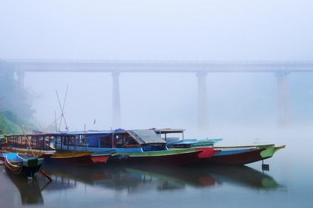 Nong Khiaw Boat station at misty morningの写真素材