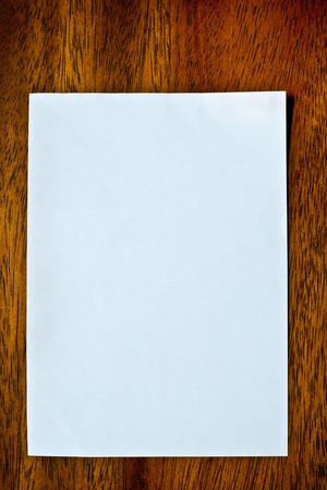 Blank paper on brown wood texture (mahogany)の写真素材