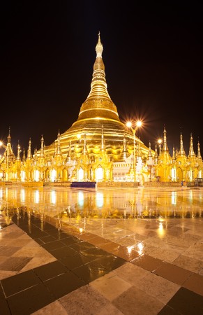 The Shwedagon Pagoda made of gold. It sits upon holy Singuttara Hill. It was built over 2500 year ago. The pagoda located in Yangon, Burmaの写真素材