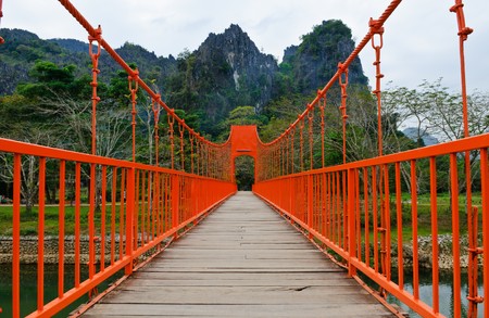 Red bridge over song river, vang vieng, laosの写真素材