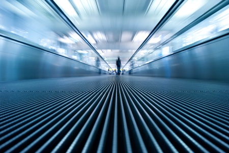 moving escalator in airport perspective viewの写真素材