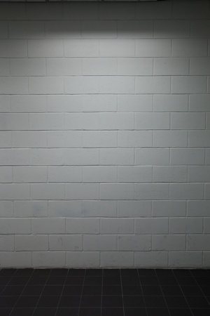 white brick wall pavement with dim lightingの写真素材