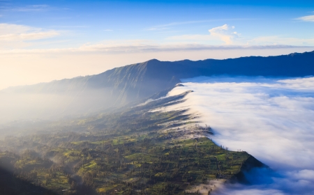 Village and Cliff at Bromo Volcano in Tengger Semeru national park, Java, Indonesiaの写真素材