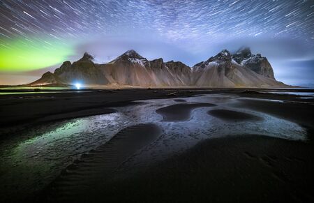 Vestrahorn mountain with Aurora borealis and startrails, Stokksnes, Icelandの写真素材