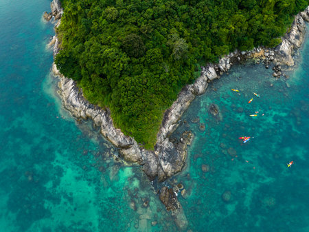 Aerial top view tourists kayaking, swimming and snorkeling in andaman sea at Koh Man island, Phuket, Thailandの写真素材