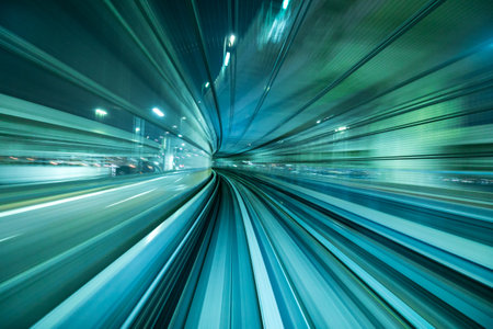 Motion blur of train moving inside tunnel in Tokyo, Japanの写真素材