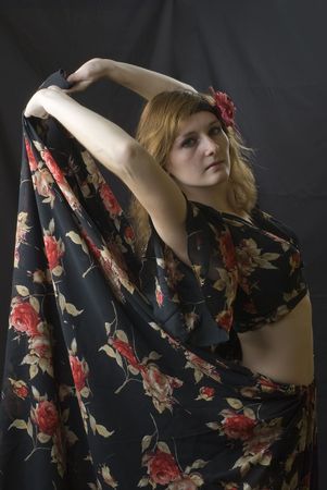 Dancing woman at black background in studioの写真素材