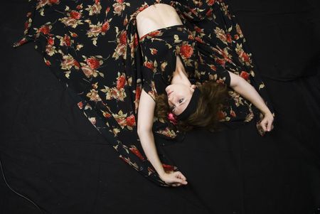 Dancing woman at black background in studioの写真素材