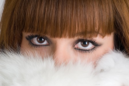 Portrait of a beautiful girl wearing white furの写真素材
