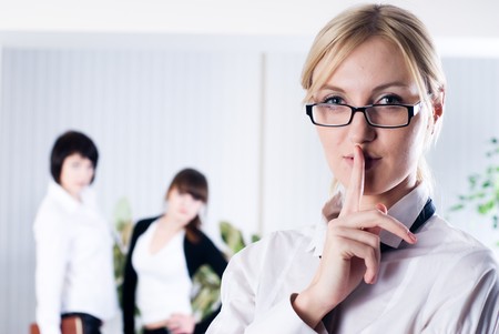 Woman with a Keep it quiet expression in officeの写真素材