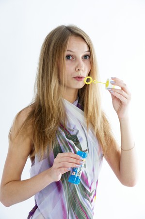 Attractive girl with soap bubblesの写真素材