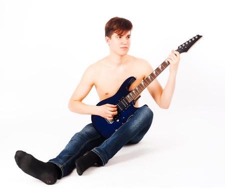 Young attractive man with electric guitar  Isolated on whiteの写真素材