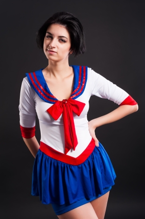 Young beautiful woman in sailor costume at black backgroundの写真素材