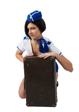 Attractive young stewardess with suitcase isolated over white backgroundの写真素材