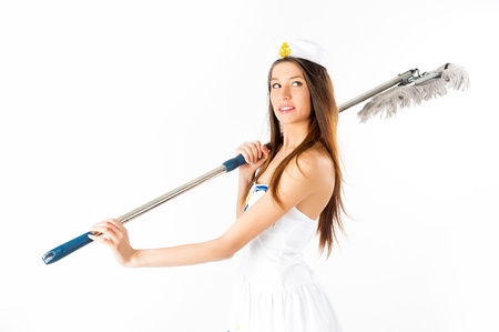 Young beautiful woman in sailor suit with mop at white backgroundの写真素材