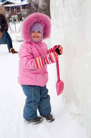 Portrait of lovely little toddler girl on beautiful winter day in ice parkの写真素材