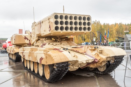 Nizhniy Tagil, Russia - September 25  2013  Visitors examine military equipment on exhibition range  TOS-1A system fighting vehicle  Buratino   Russia Arms Expo-2013 exhibitionのeditorial素材
