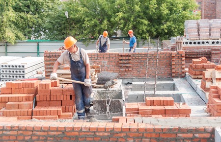 Tyumen, Russia - July 31, 2013  JSC Mostostroy-11  Construction of a 18-storeyed brick residental...