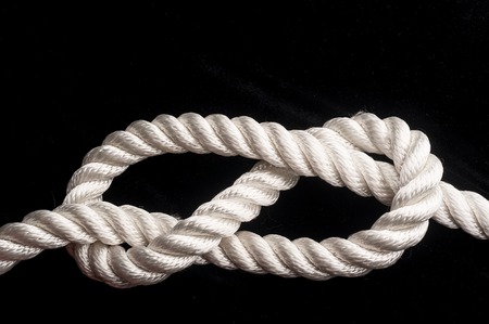 Figure of eight knot over black backgrounfの写真素材